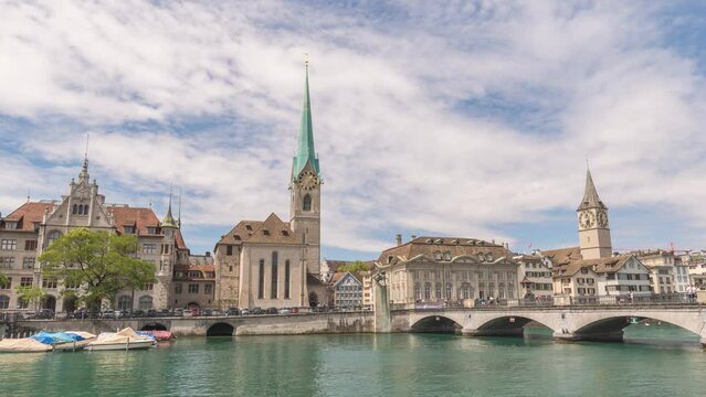Zurich Switzerland time lapse 4K, city skyline night timelapse at Fraumunster Church and Munster Bridge