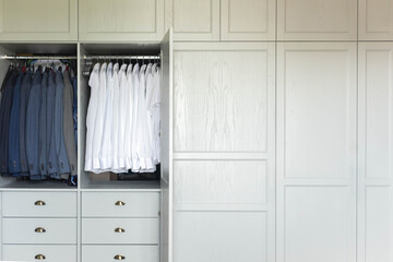 Male wardrobe furniture for business clothing neatly storage organization. Man closet with garment