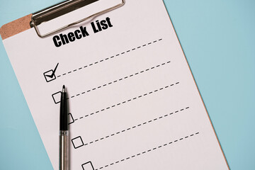 Pen tick mark sign with check list paper sheet and clipboard on blue background for to do list or...