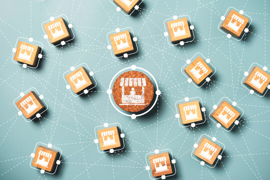 Business sale growth and expand shop franchise concept, Store illustration print screen on wooden cube block connection link with others shop and supermarket.