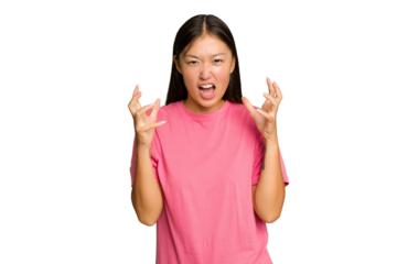 Young Asian woman isolated on green chroma background screaming with rage.