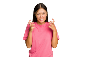 Young Asian woman isolated on green chroma background upset screaming with tense hands.