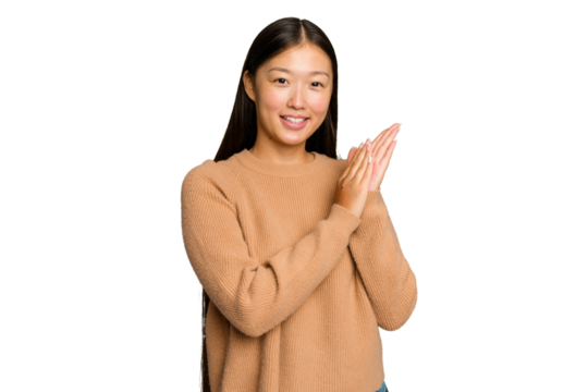 Young Asian woman isolated on green chroma background feeling energetic and comfortable, rubbing hands confident. - Powered by Adobe