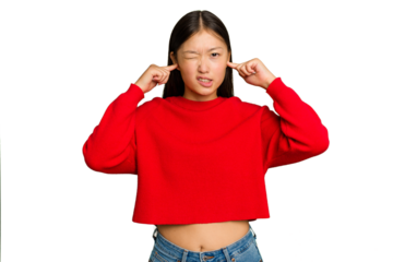 Young Asian woman isolated on green chroma background covering ears with fingers, stressed and desperate by a loudly ambient.
