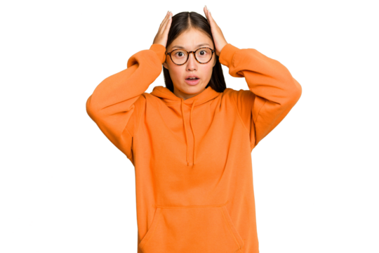 Young Asian woman isolated on green chroma background being shocked, she has remembered important meeting.