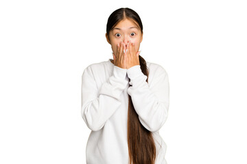 Young Asian woman isolated on green chroma background shocked, covering mouth with hands, anxious...