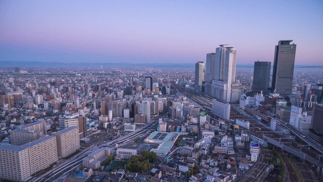 Nagoya Aichi Japan time lapse 4K, city skyline night to day timelapse at Nagoya railway station and business center