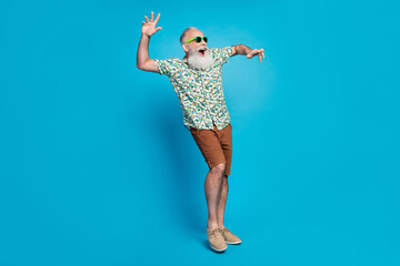 Full length photo of funny dancing relaxed grandfather vacation wear summer outfit crazy laugh screaming isolated on bright blue color background