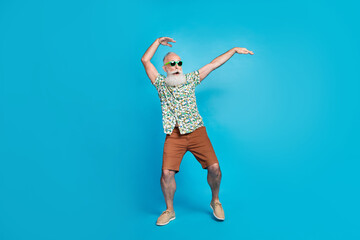 Full length photo of bearded funny excited granddad wear green stylish sunglass hands up posing crazy carefree sale isolated on blue color background