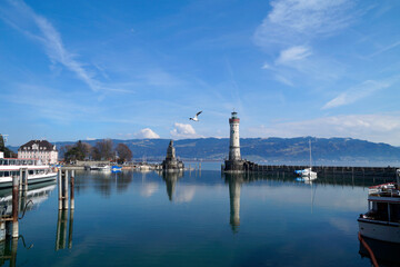 Fototapeta na wymiar the scenic harbour of Lindau island on lake Constance or Bodensee on a sunny spring day, Germany