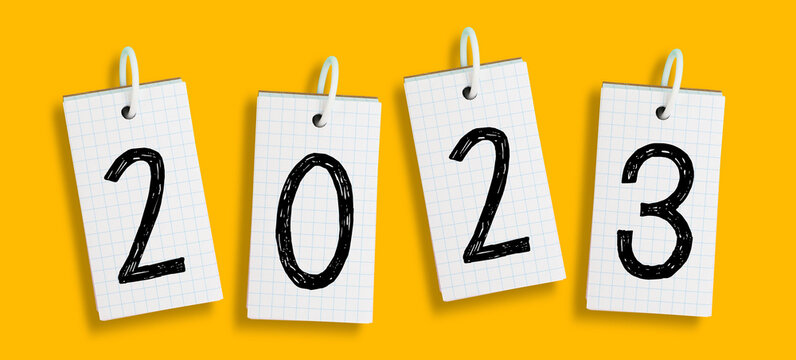 Note papers with New Year 2023 on yellow background