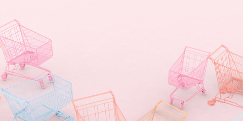 Different pastel colored shopping carts on pink background. Black Friday sales fuss minimalistic concept. Shop online, free delivery, Cybermonday, Discounts, Valentines and International Women's Day
