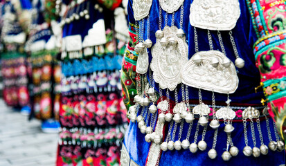 Chinese women in blue traditional festival clothes and silver accessories