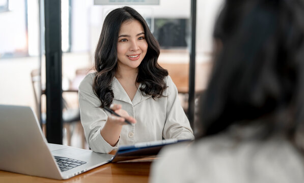 Young beautiful asian woman doing a job interview.