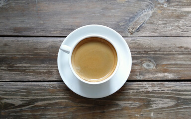 cup of coffee on wooden table