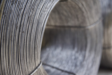New metal wire wound into round coils in stock