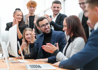 happy working group applauds the project Manager
