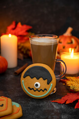 Halloween cookie with candles. Spooky ginger bread cookies dark moody background
