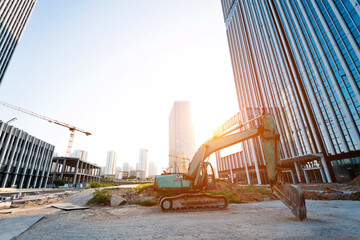 Excavator on construction site office building