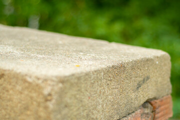 Backdrop with old stone parapet in soft focus. Template for adding an object.
