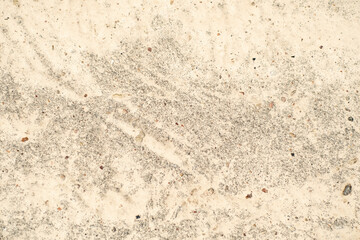Background with concrete wall unevenly covered with paint.