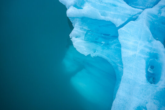Textured surface of frozen lake with glaciers