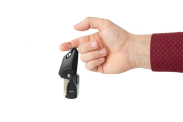Hand with car key, isolated 