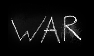 War inscription in chalk on a blackboard. The inscription WAR on the blackboard.