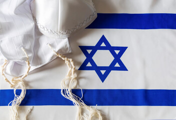 The tallit katan (Yiddish, Ashkenazic Hebrew tallis koton; small tallit) is a fringed garment...