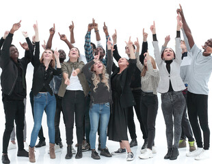 Casual group of excited friends with arms up isolated on white