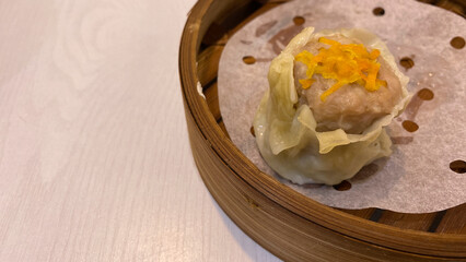 Pork steamed dumpling in dim sum basket