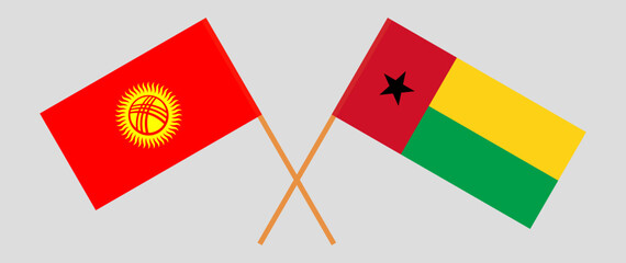 Crossed flags of Kyrgyzstan and Guinea-Bissau. Official colors. Correct proportion