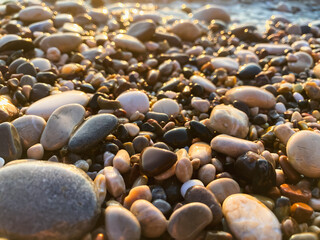 Large and small stones on the beach. Selective focus.