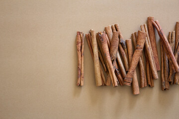 natural eco cinnamon sticks on a brown background