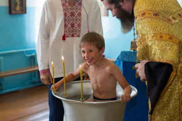 Orthodox baptism of a Belarusian child in a church.