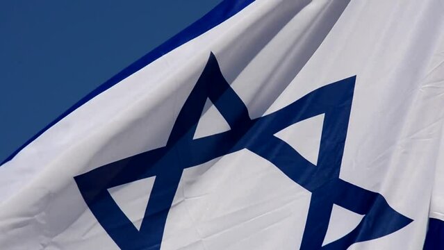 The flag of Israel against the background of the blue