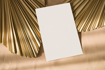 4x6 card mockup with sunlight shadows and dry palm leaf
