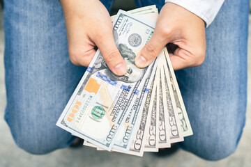 Dollars in man's hands. Profits and savings concept. 