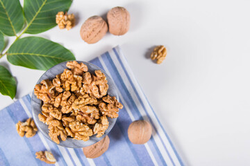 Мarble bowl filled with shelled walnuts