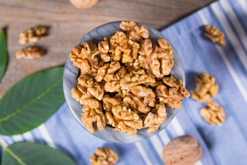 Мarble bowl filled with shelled walnuts