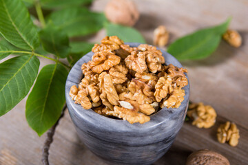 Мarble bowl filled with shelled walnuts
