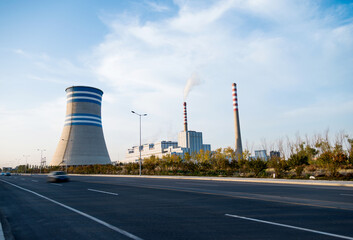 Fototapeta na wymiar Coal power factory with chimney and cooling towers
