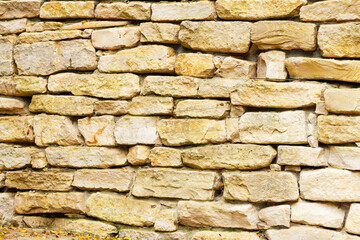 Ancient natural stone wall background and pattern