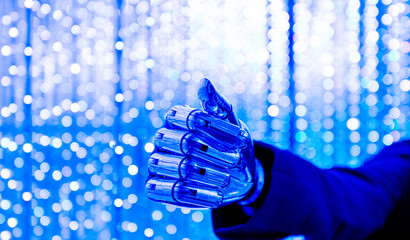 Close-up of robotic holding fist with a blurred backgound