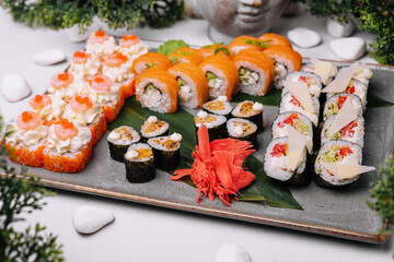 Fresh sushi traditional japanese food on big plate
