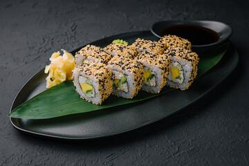 Sushi roll with avocado, vegetables and sesame