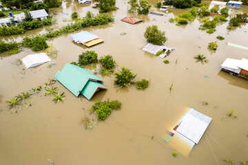 High-angle view of the Great Flood, Meng District, Thailand, on October 3, 2022, is a photograph from real flooding. With a slight color adjustment 