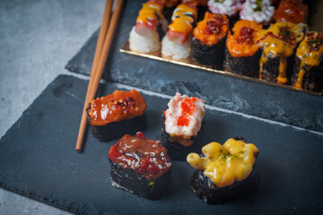 Sushi is a Japanese dish of prepared vinegared rice (鮨飯, sushi-meshi), usually with some sugar and salt, accompanied by a variety of ingredients