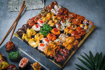 Sushi is a Japanese dish of prepared vinegared rice (鮨飯, sushi-meshi), usually with some sugar and salt, accompanied by a variety of ingredients