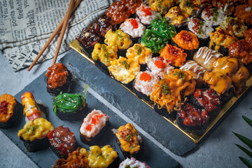 Sushi is a Japanese dish of prepared vinegared rice (鮨飯, sushi-meshi), usually with some sugar and salt, accompanied by a variety of ingredients